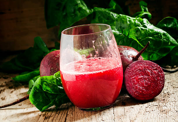 istock Large glasses with red beet juice, fresh beetroot with tops 521224060