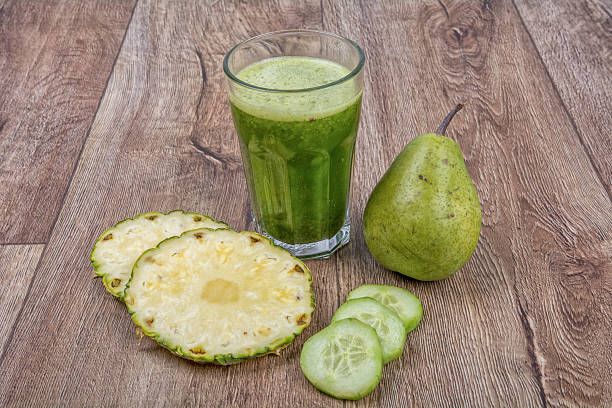 istock Blended smoothie with ingredients on wooden table 521224438