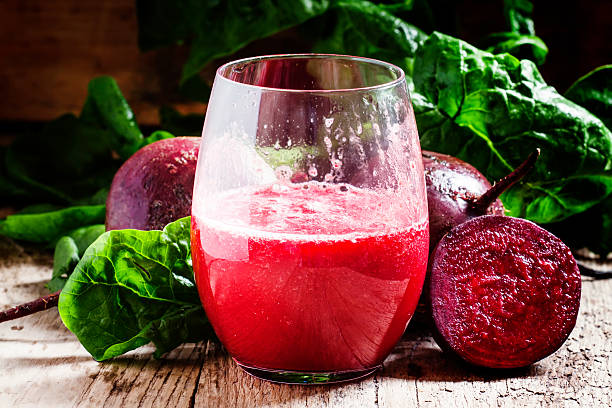 istock Large glasses with red beet juice, fresh beetroot with tops 521224450