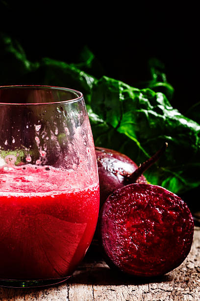istock Large glasses with red beet juice, fresh beetroot with tops 521224706