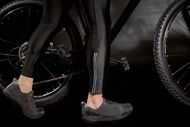 istock Bicyclist Legs walking beside Bicycle 521225334