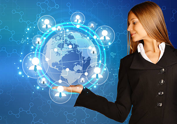 istock woman showing holding on world map and teamwork people icon. 521226375