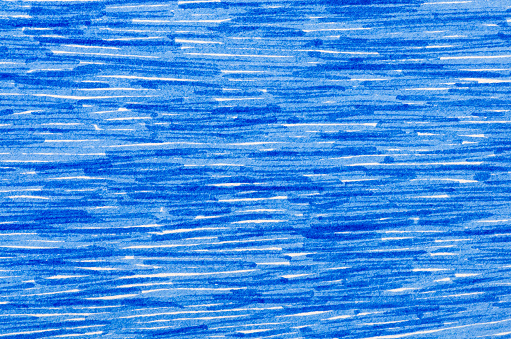 Marcador azul garabatos en fondo de papel de color blanco photo