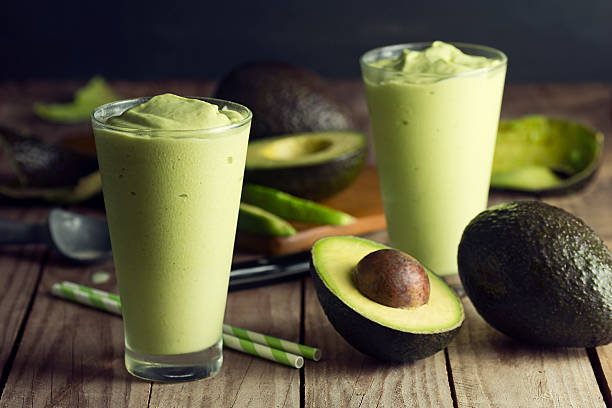 istock Two Avocado Shakes or Smoothies with Ingredients 521228175