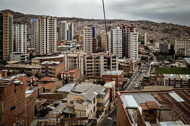 La Paz, Bolivia - September 4, 2014: The city of La Paz with its tall buildings, slums, the Andes mountains, and hectic urban sprawl. Photo taken during a cold winter day.