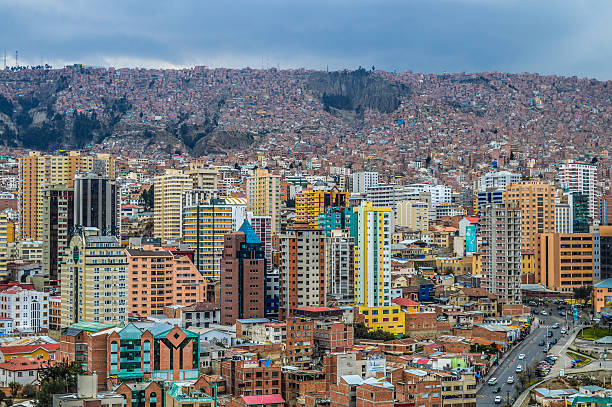 La Paz, Bolivia - September 4, 2014: The city of La Paz with its tall buildings, slums, the Andes mountains, and hectic urban sprawl. Photo taken during a cold winter day.