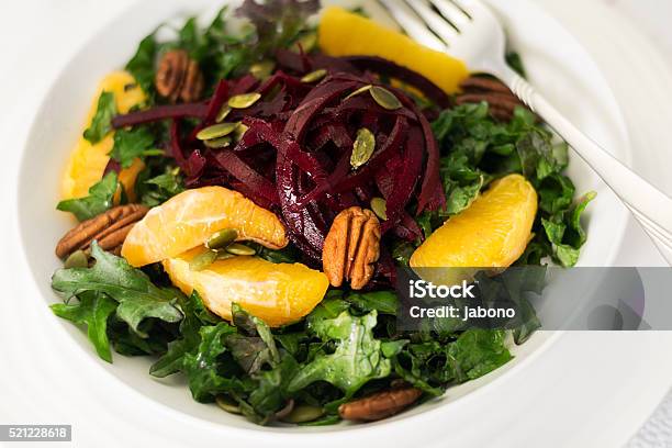 Kale Beetroot Orange Salad On White With A Fork Stock Photo - Download Image Now - Color Image, Common Beet, Crucifers