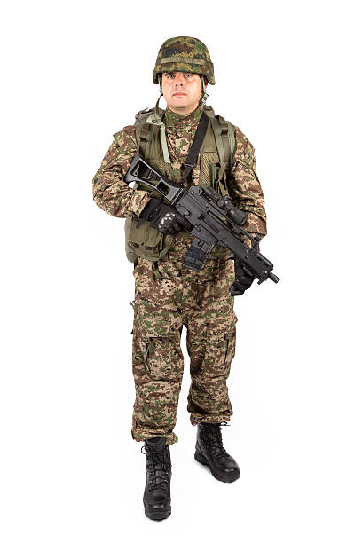 istock Soldier with rifle on a white background 521228771