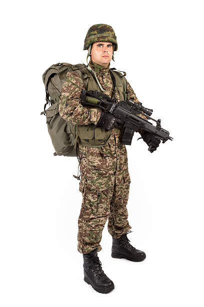 istock Soldier with rifle on a white background 521228793