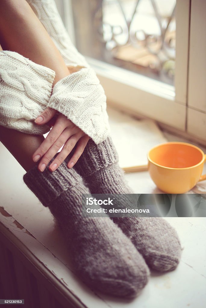 female legs in woolen socks close up Sweater Stock Photo