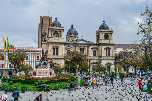 La Paz, Bolivia - August 31, 2014: The famous Plaza Murillo in central La Paz. Photo taken during the day and contains people, and pigeons, enjoying the square.