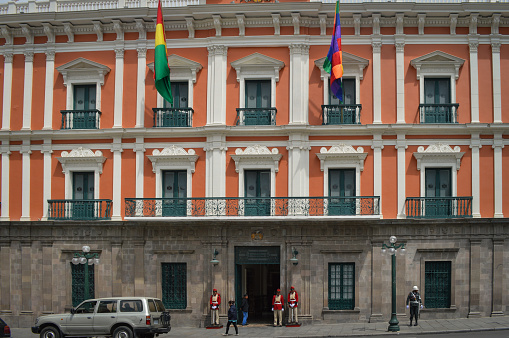 La Paz, Bolivia - August 31, 2014: The Government Palace in Plaza Murillo. Photo taken during the day and contains several guards out front.