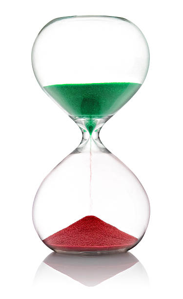 istock Hourglass with green and red sand 521230704