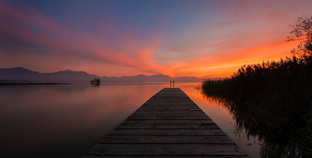 istock Wooden Jetty into Lake Chiemsee after Sunset 521231127