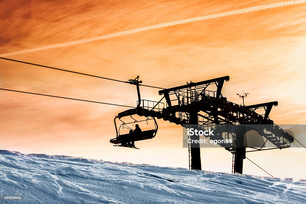 Chair Lift The skiers riding a chairlift.Krvavec,Slovenija;Europe Ski Stock Photo
