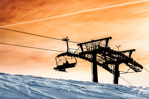 Chair Lift The skiers riding a chairlift.Krvavec,Slovenija;Europe krvavec stock pictures, royalty-free photos & images