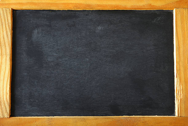 istock vintage wooden blackboard on wooden table with space for text 521232834