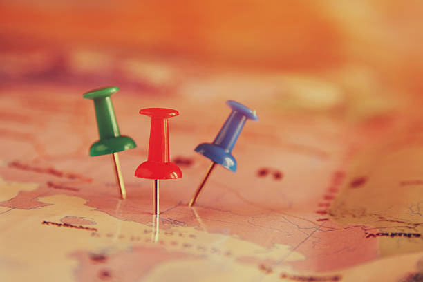 istock pins attached to map, showing location or travel destination 521232896