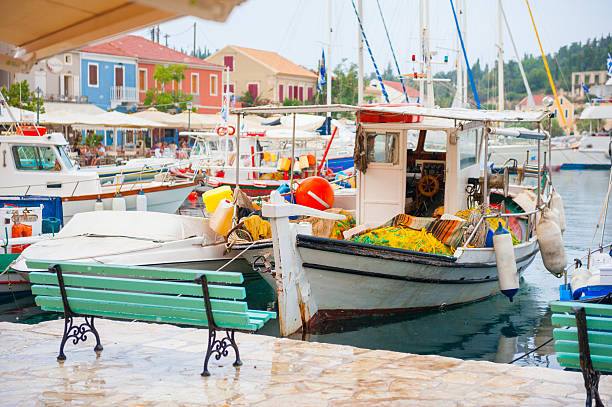 After the rain in Fiskardo harbor with fishing boats parked 