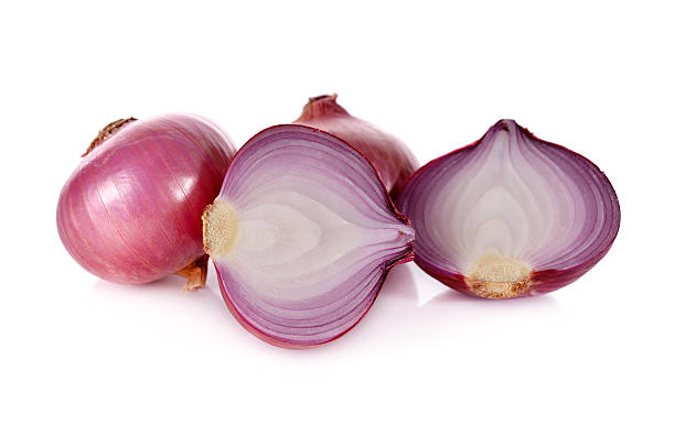 istock whloe and half cut red onion, shallots on white background 521234716