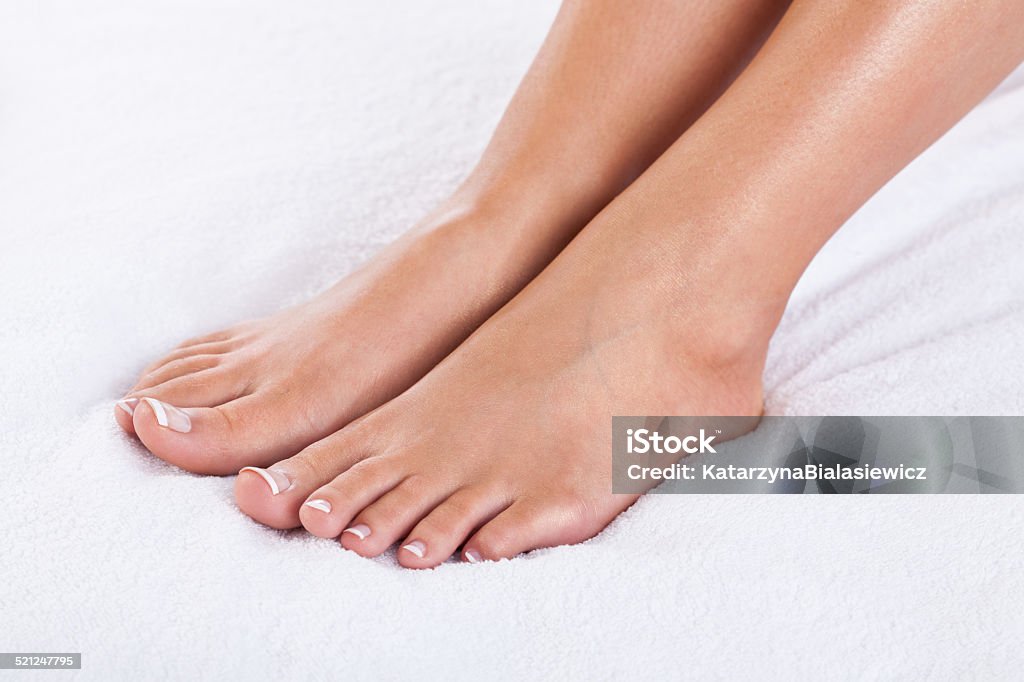 French pedicure Close-up of female feet with french pedicure Adult Stock Photo