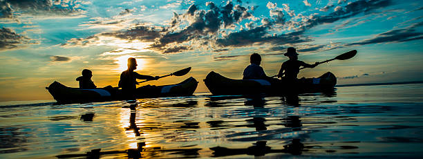 istock Family Sea Kayaking at Sunset 521250247