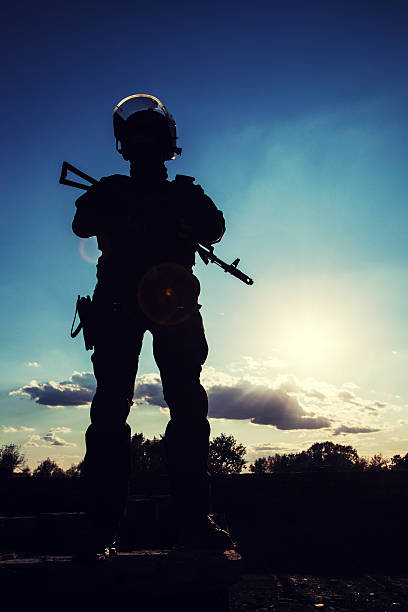 istock police officer with weapons 521250271