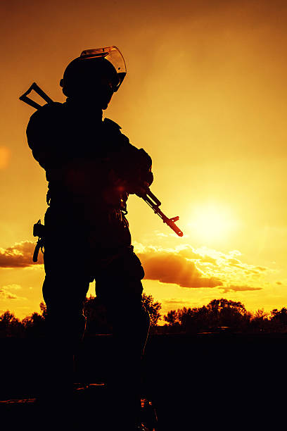 istock police officer with weapons 521250275