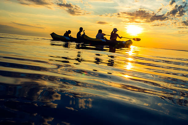 istock Family Sea Kayaking at Sunset 521250287