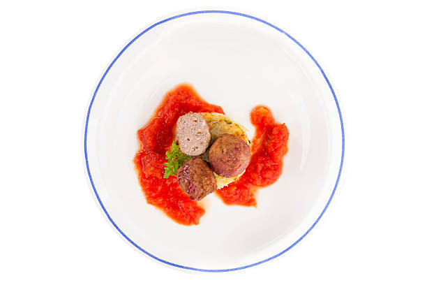 Meatballs on plate, top view. Meatballs with tomato sauce and mashed potatoes on plate isolated on white background, top view. Traditional mediterranean eating. healthy eating red above studio shot stock pictures, royalty-free photos & images