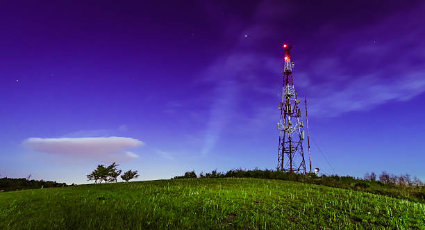 Antenna tower Night shot of the antenna tower on the top of the hill antenna aerial photos stock pictures, royalty-free photos & images
