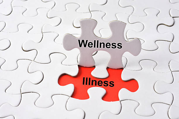 istock Wellness and Illness concept on puzzle 521260184