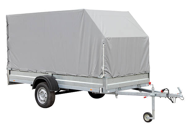 istock Tarpaulin car trailer. 521261164