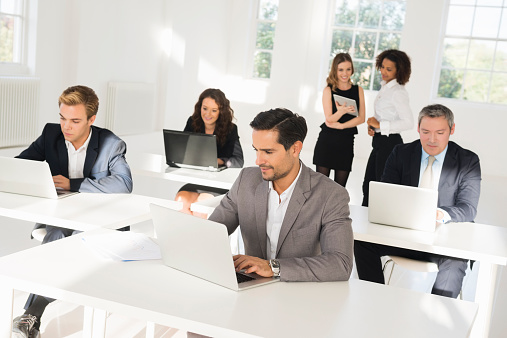 Group of multi-ethnic business people working in busy office