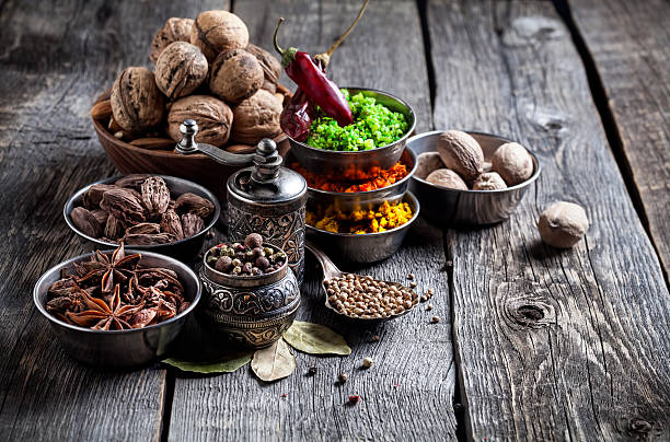 istock Spices and nuts at wooden table 521262364