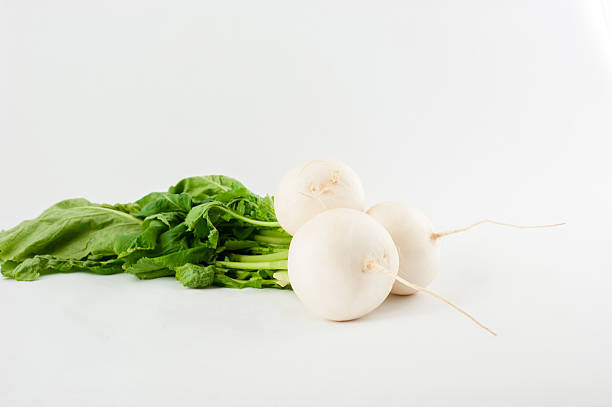 istock Daikon radishes isolated on white background 521262975