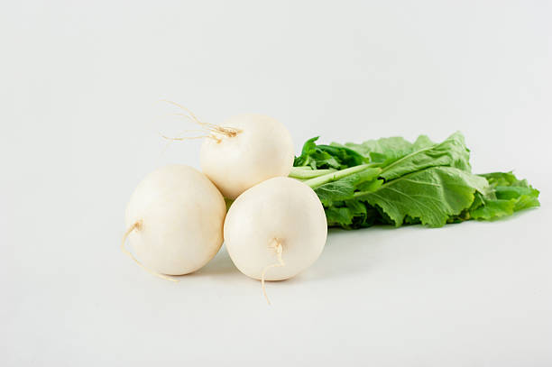 istock Daikon radishes isolated on white background 521262979