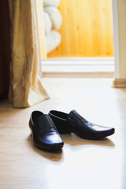 istock men's boots on a floor in the room 521263660