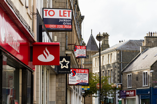 Galashiels, Scotland, UK - August 28, 2012: A series of To Let signs on the main shopping street in Galashiels.