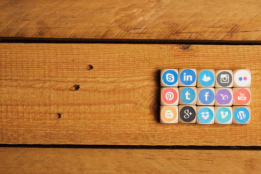 Berlin, Germany - November 1, 2014: Cubes of internet icons as game. Set of dices with logos from most popular social media networks, including Facebook, Google, Instagram, Twitter, Pinterest, LinkedIn and many more