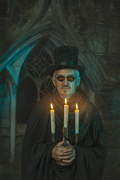 istock Evil sorcerer with a candelabra in hand. 521264029