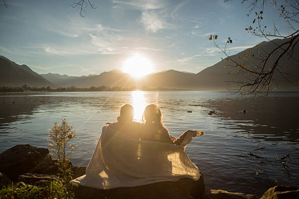 istock Couple by the lake watching sunrise-Autumn 521264145