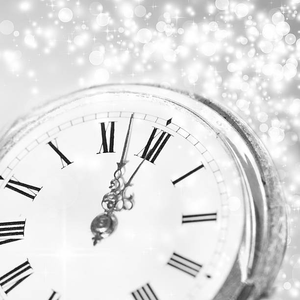 istock New Year's at midnight - Old clock and holiday lights 521264653