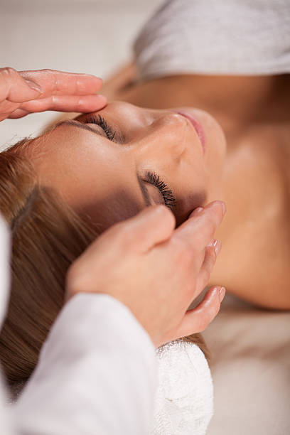istock Woman relaxing during face massage 521264809