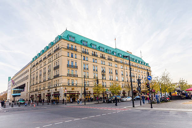 Berlin, Germany - October 27, 2014: people walk in front of Hotel Adlon at the, Pariser Platz, Berlin, Germany. Adlon is the most famous and luxury hotel in Berlin.