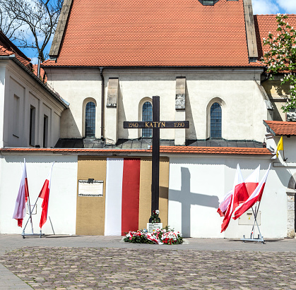Krakow, Poland - May 4, 2014:  Cross of Katyn placed on the square in front of the church St. Giles in (1990) in Krakow, Poland.