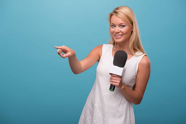 istock Very beautiful TV presenter 521266001