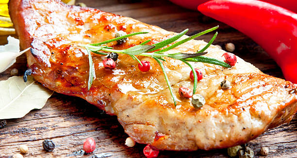 istock Juicy Grilled Pork Steak with Condiments 521266869