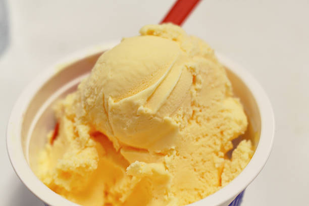 Ice cream (derived from earlier iced cream or cream ice) is a sweetened frozen food typically eaten as a snack or dessert. It is usually made from dairy products, such as milk and cream, and often combined with fruits or other ingredients and flavours. It is typically sweetened with sucrose, corn syrup, cane sugar, beet sugar, and/or other sweeteners. Typically, flavourings and colourings are added in addition to stabilizers. The mixture is stirred to incorporate air spaces and cooled below the freezing point of water to prevent detectable ice crystals from forming. The result is a smooth, semi-solid foam that is solid at very low temperatures