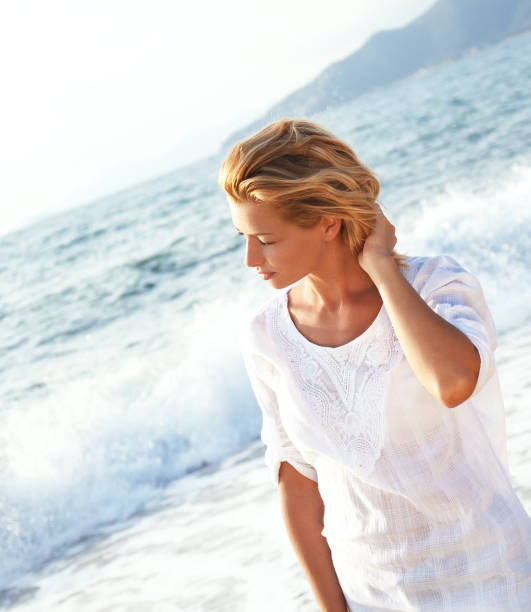 istock Attractive woman on the beach 521267139